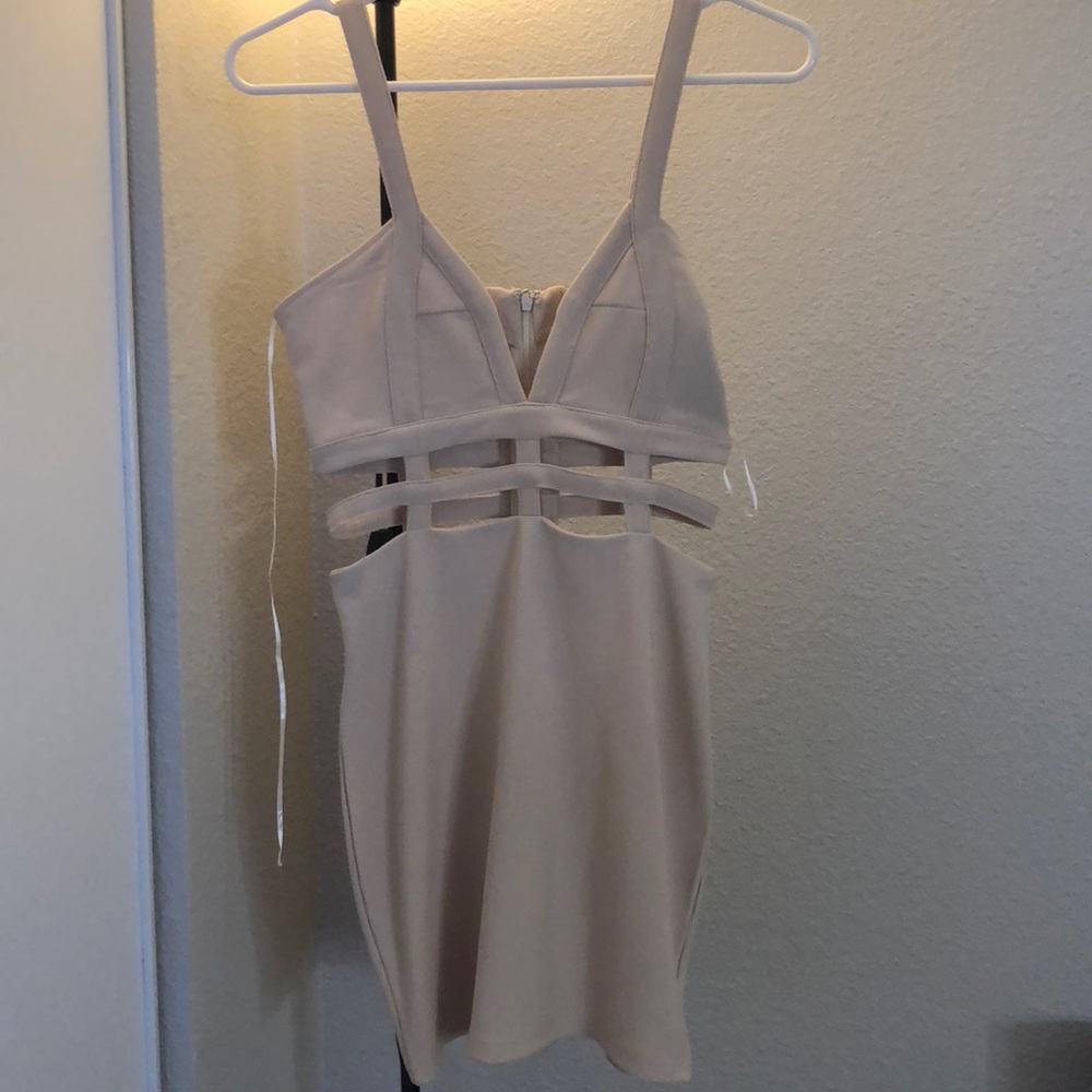 Never Worn cream dress with cut outs!
